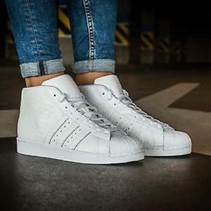 all white high top shell toe adidas